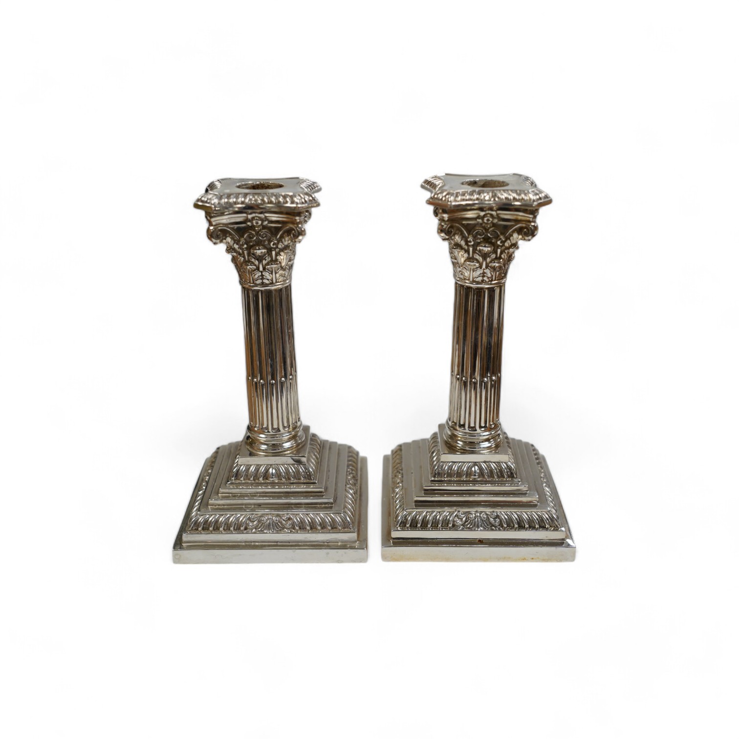 A pair of modern silver Corinthian column dwarf candlesticks, by James Dixon & Sons Ltd, Sheffield, 1991, height 16.4cm, weighted. Condition - fair